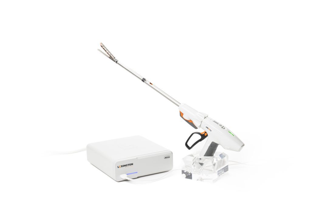 The AEON™ Powered Surgical Stapling System from Lexington Medical, Inc., showing the Powered Handle (Medium) with a reload loaded alongside the AEON™ Control Unit in a top-angled view.